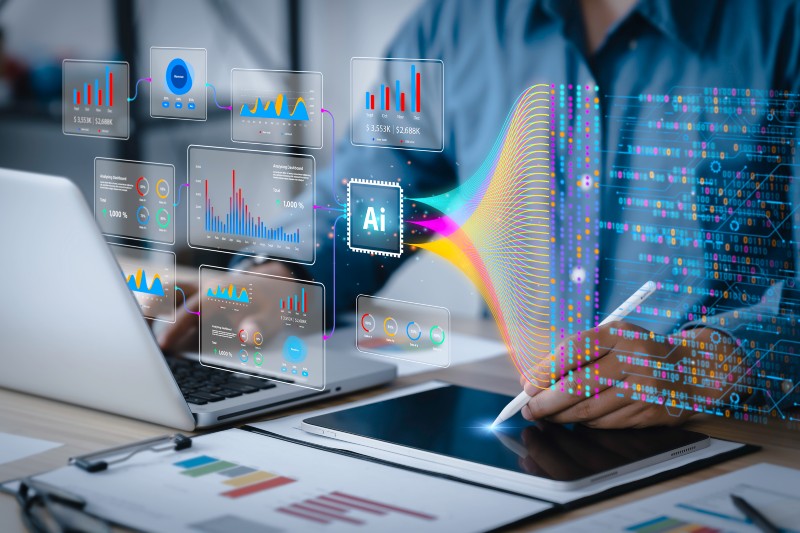 Analyst or Scientist uses a computer and dashboard for analysis of information on complex data sets on computer.